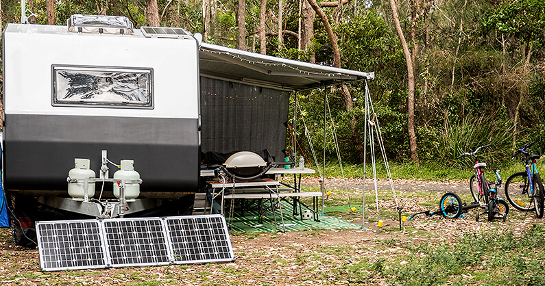 Solar panel outside of family caravan